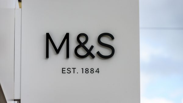 The manager of a £9 billion investment firm has halved its stock in Amazon while buying shares in Marks & Spencer.