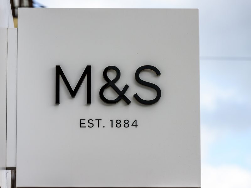 The manager of a £9 billion investment firm has halved its stock in Amazon while buying shares in Marks & Spencer.