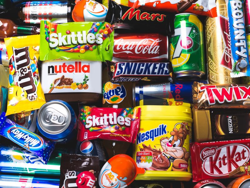 Supermarket chiefs want the government to push back its ban on junk food promotions yet again