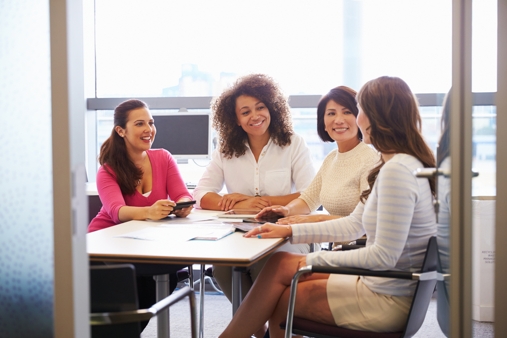 A group of people in a meeting room