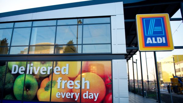 Aldi supermarket with glass windows advertising its fresh veg