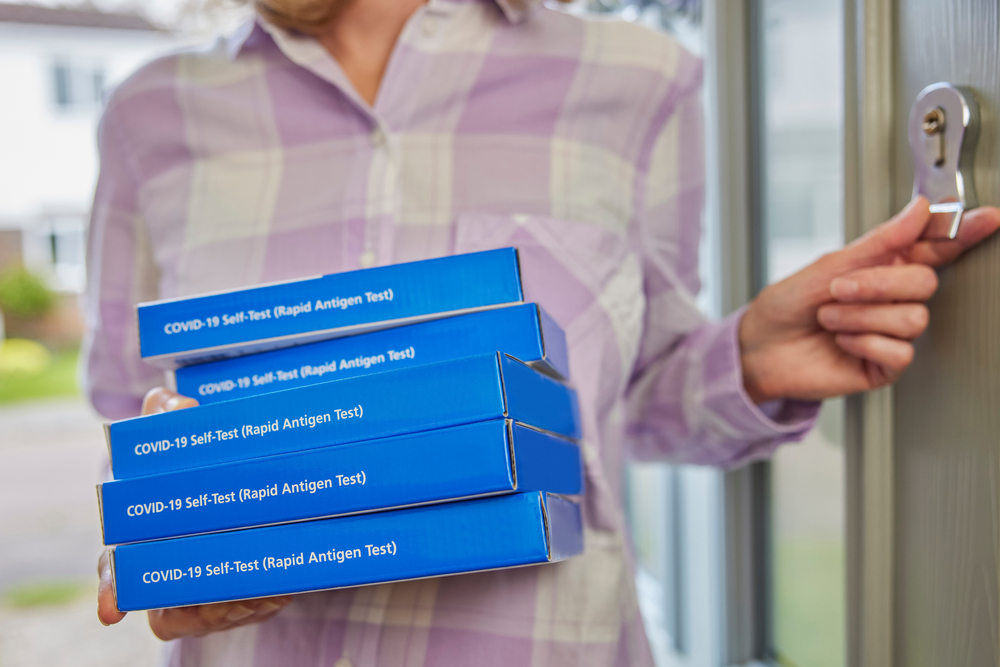 Close up of five lateral flow test kit boxes