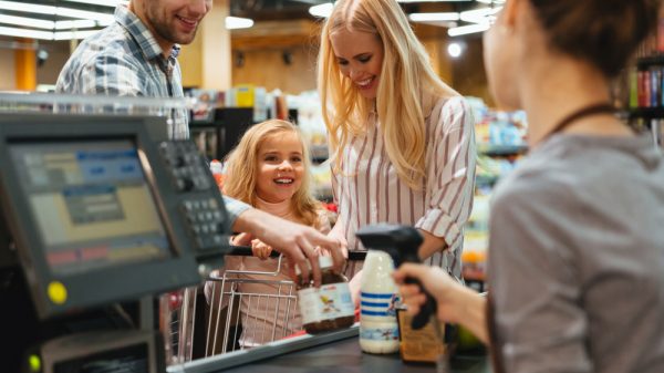 Family purchasing items at a convenience store