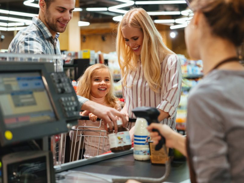Family purchasing items at a convenience store