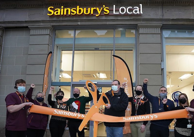 Members of staff open up the new Glasgow store
