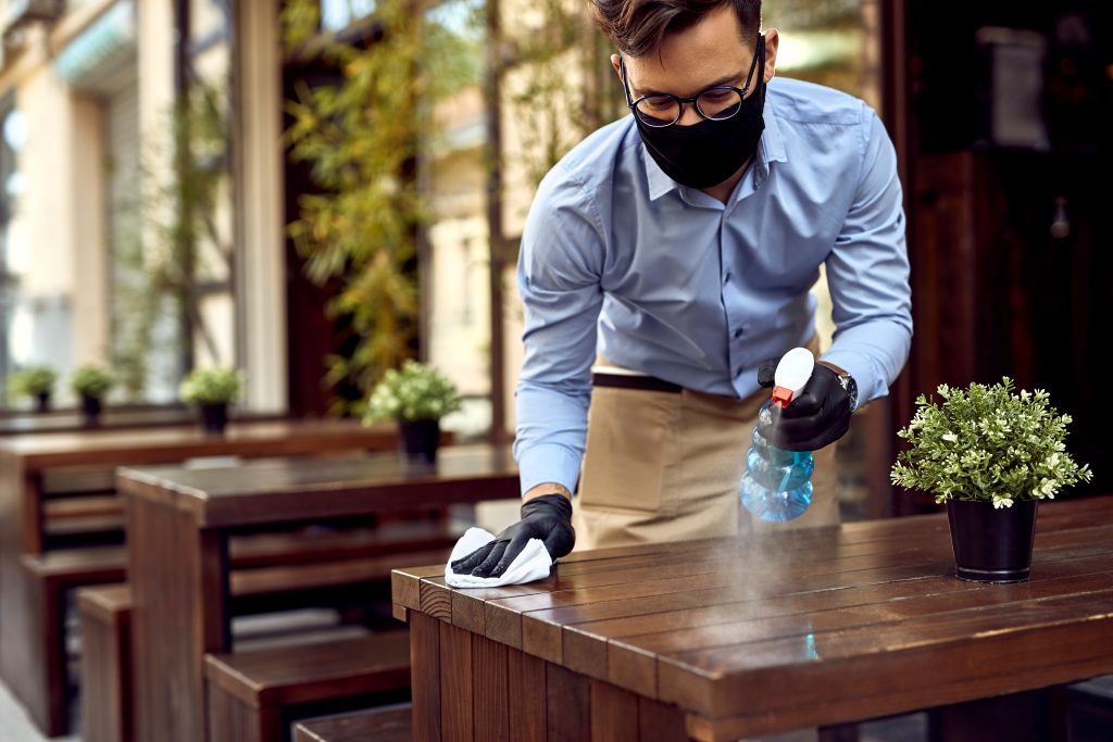 Waiter wearing mask