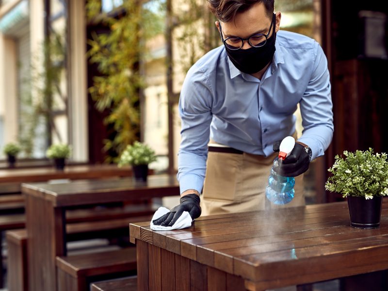 Waiter wearing mask