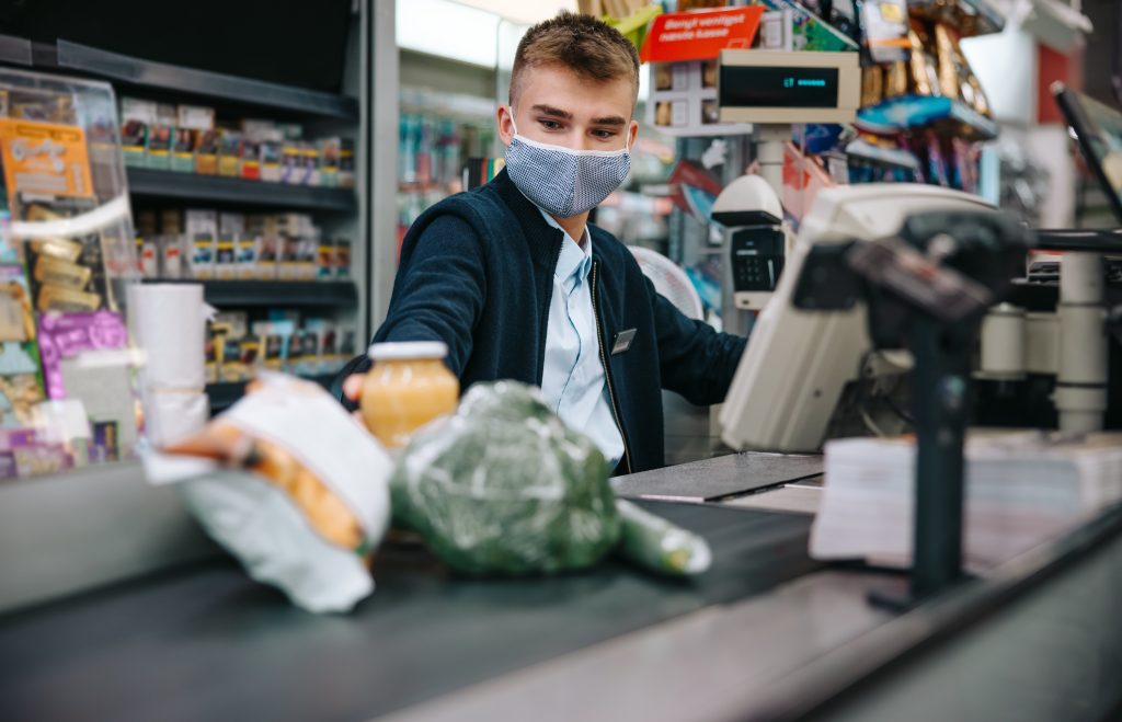 Supermarket worker on checkout