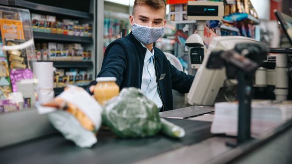 Supermarket worker on checkout