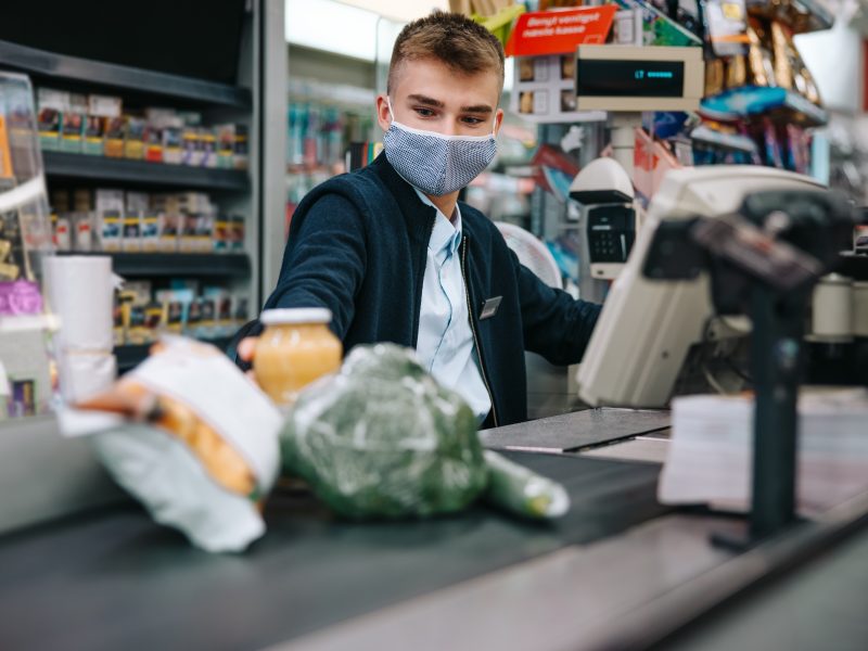 Supermarket worker on checkout