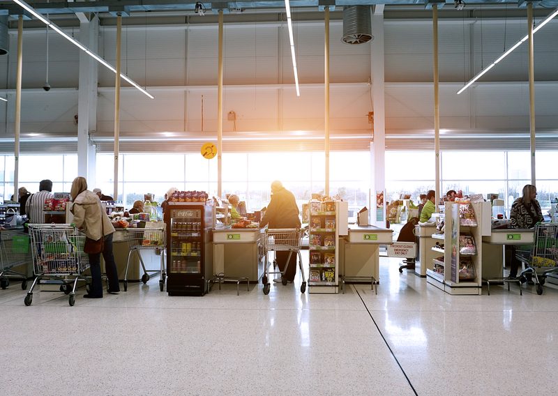 A row of busy supermarket tills.