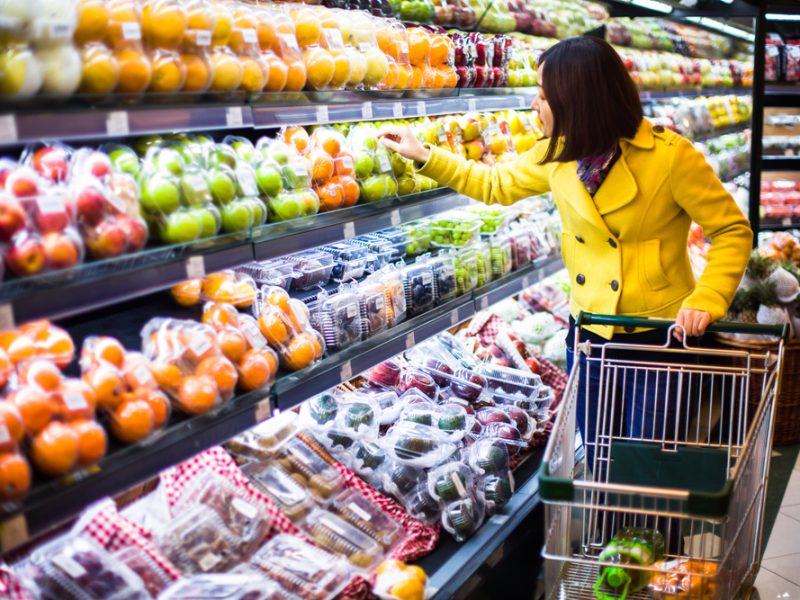 A young women shopping for fresh fruits