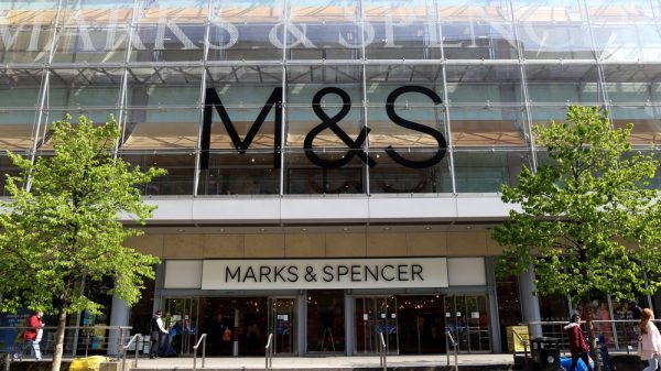An M&S storefront on a sunny day.