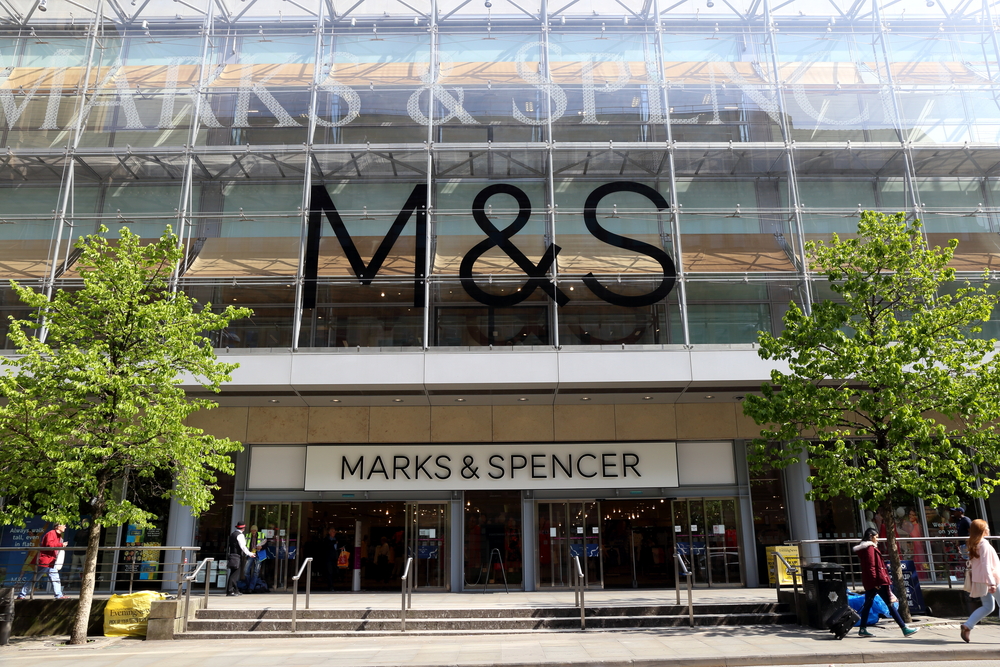 An M&S storefront on a sunny day.
