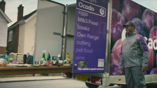 Man standing by Ocado van s=with Everyday Savers product on a table