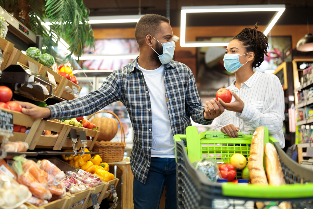 Grocery shoppers wearing customers in-store
