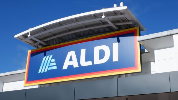 An Aldi storefront on a sunny day.