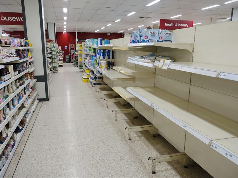 An empty health & beauty aisle in a UK supermarket.