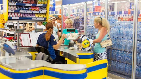 A cashier inside a Lidl supermarket.