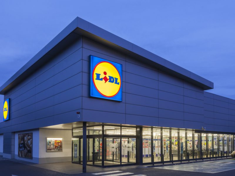 The exterior of a Lidl supermarket at night.