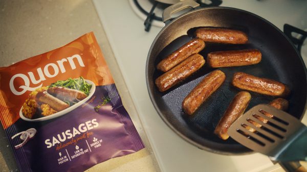 Quorn Sausages cooking in a pan