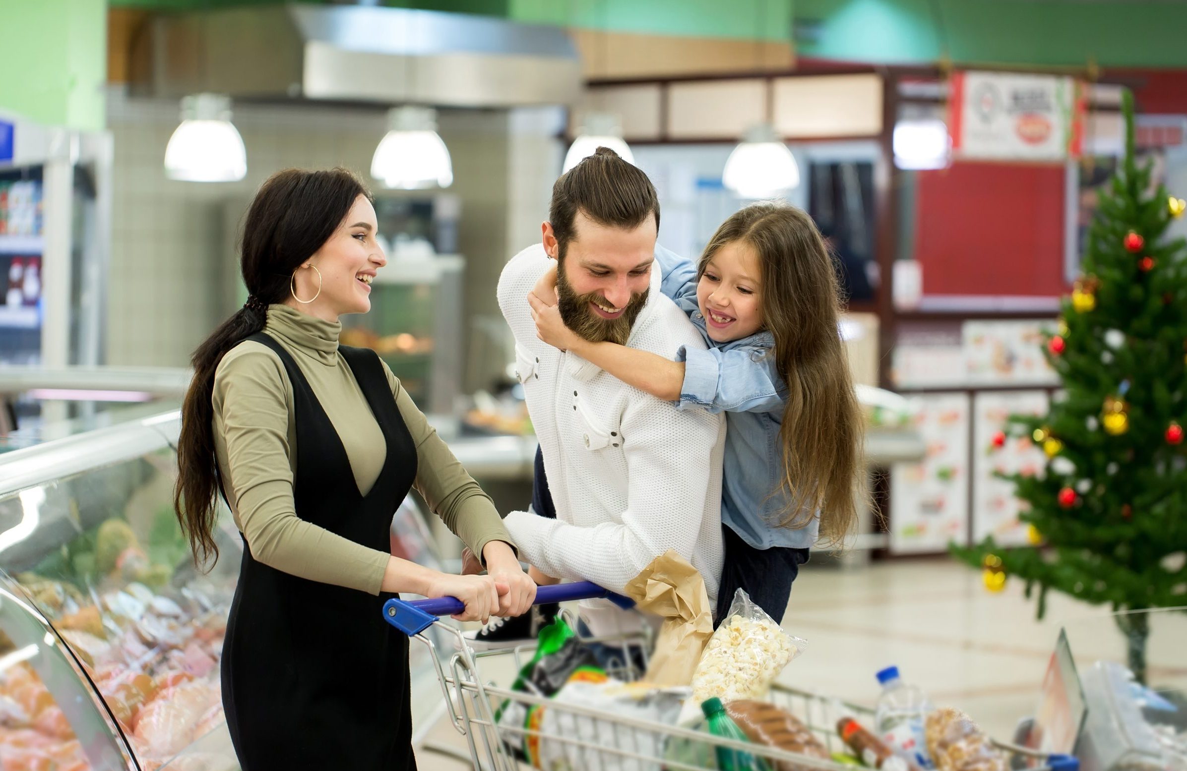 Family doing their supermarket Christmas shopping
