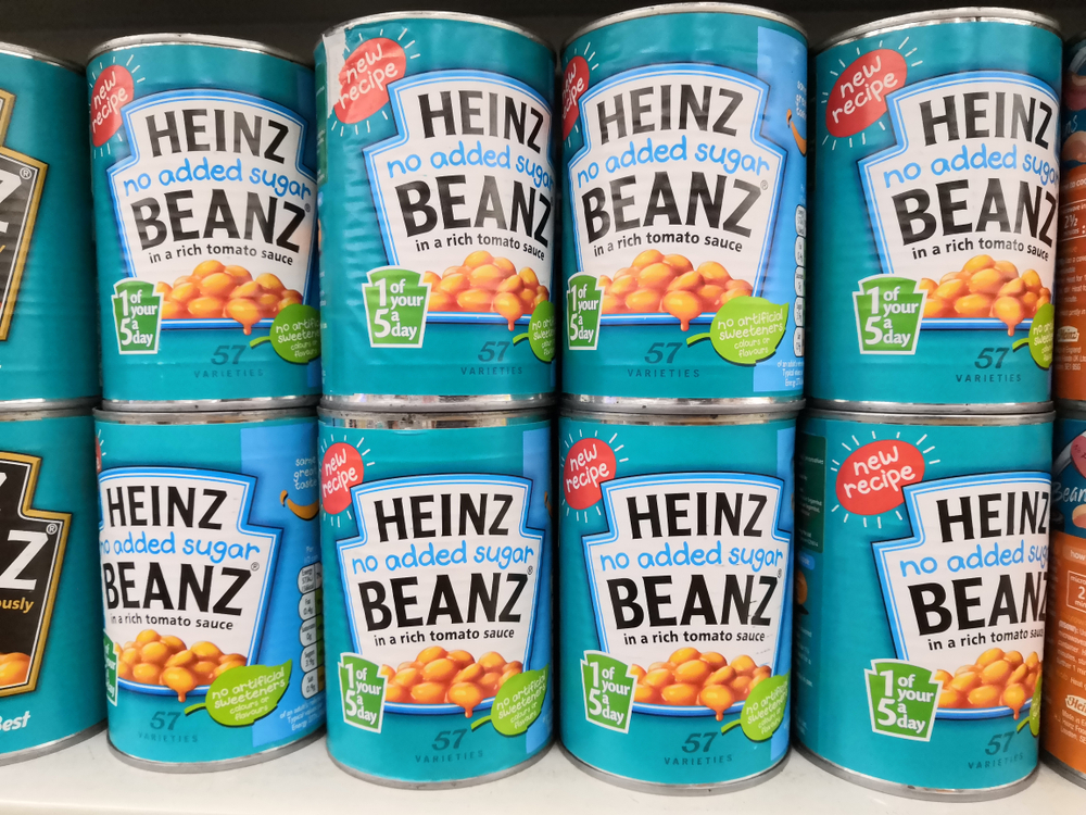 Stacks of Heinz Beanz No Added Sugar in a supermarket.