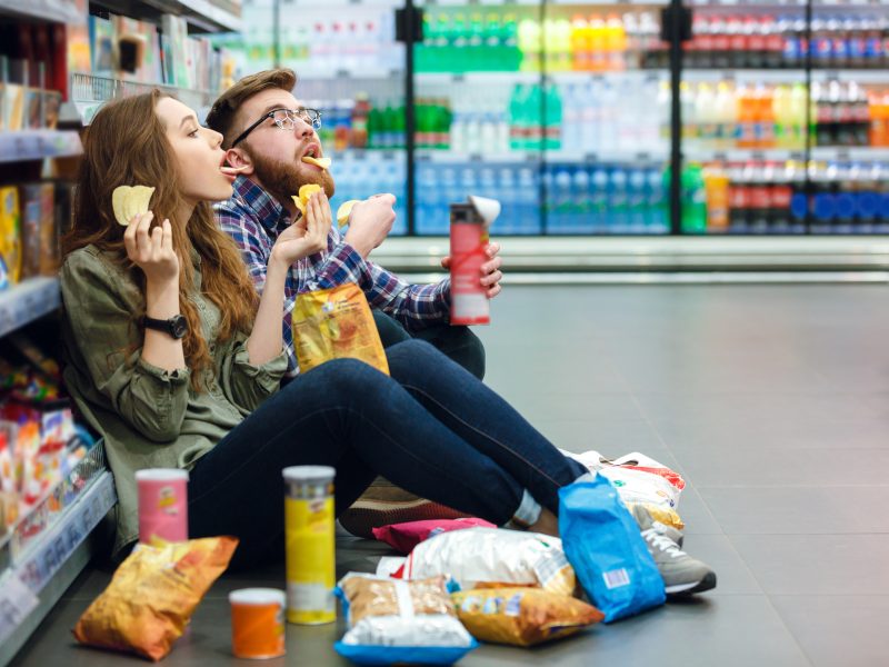 people eating junk food supermarket