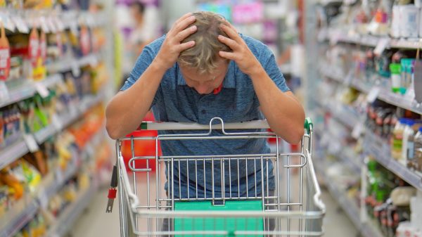 customer in a supermarket looking distraught