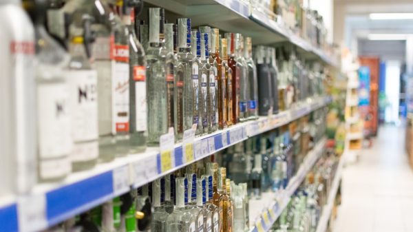 A supermarket aisle of spirits and alcohol.