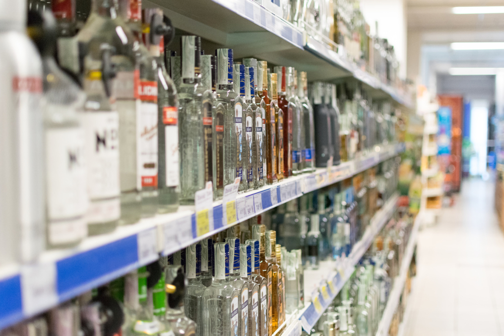 A supermarket aisle of spirits and alcohol.