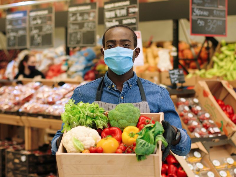 supermarket worker with covid mask