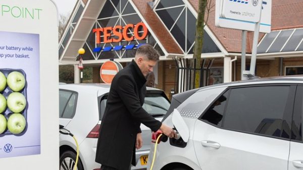 Customer using Tesco's free electric vehicle charger