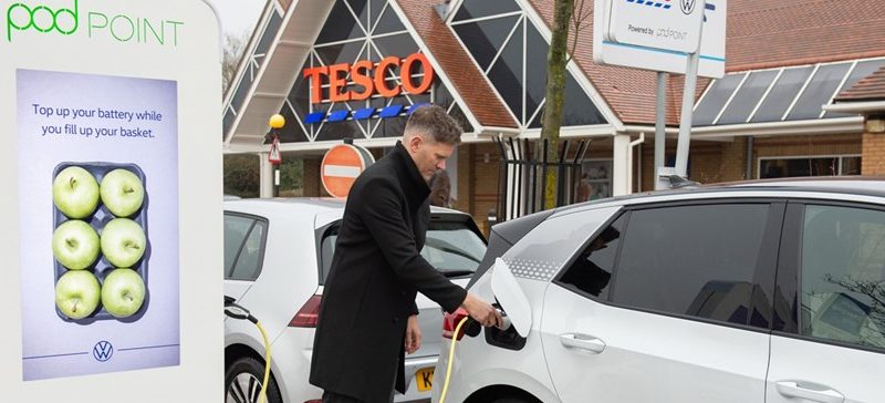 Customer using Tesco's free electric vehicle charger