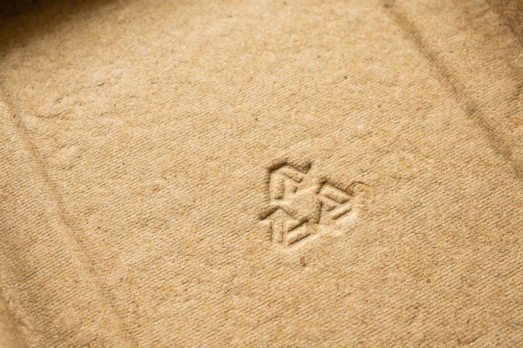 Recycling symbol on a sustainable piece of packaging
