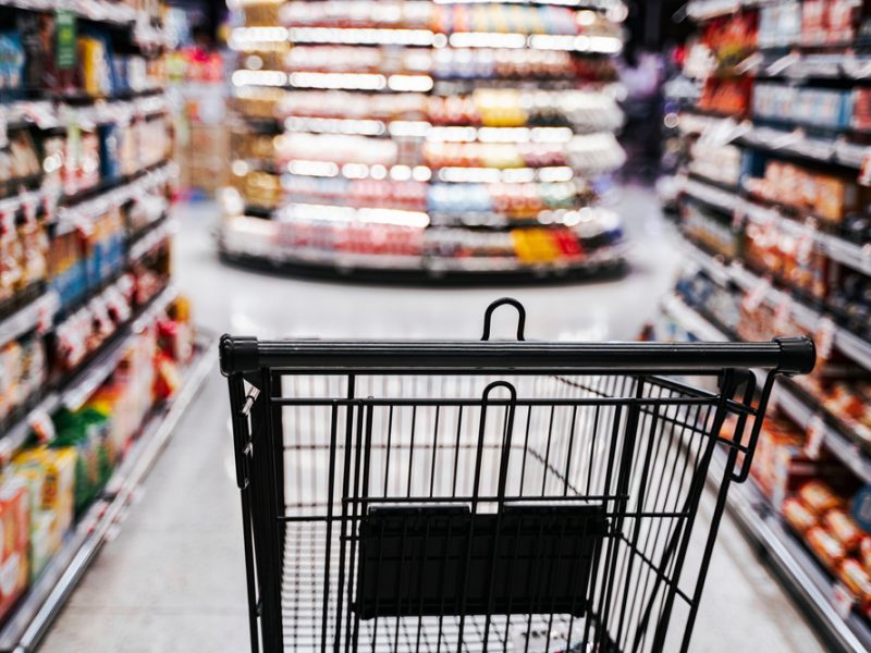 An empty shopping trolley in a supermarket.