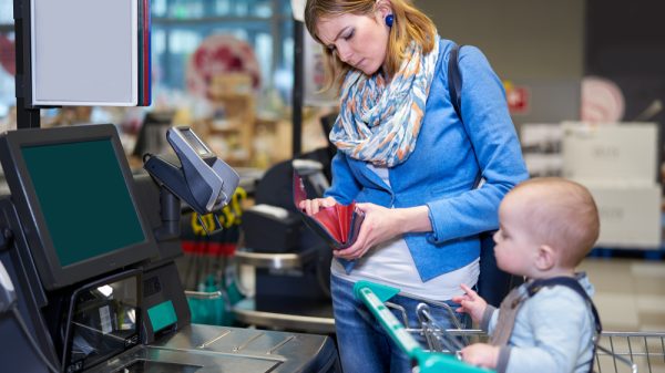 Customer checking wallet at checkout