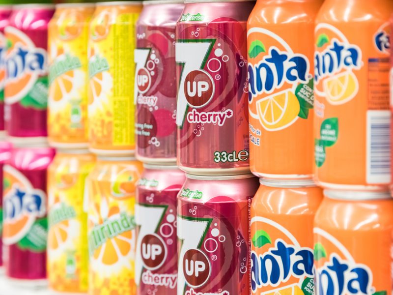 A row of canned drinks in a supermarket.