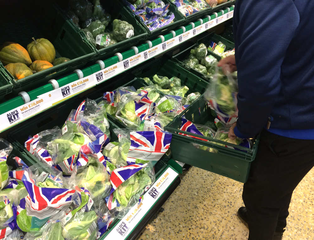 Vegetables in plastic packaging in a supermarket.
