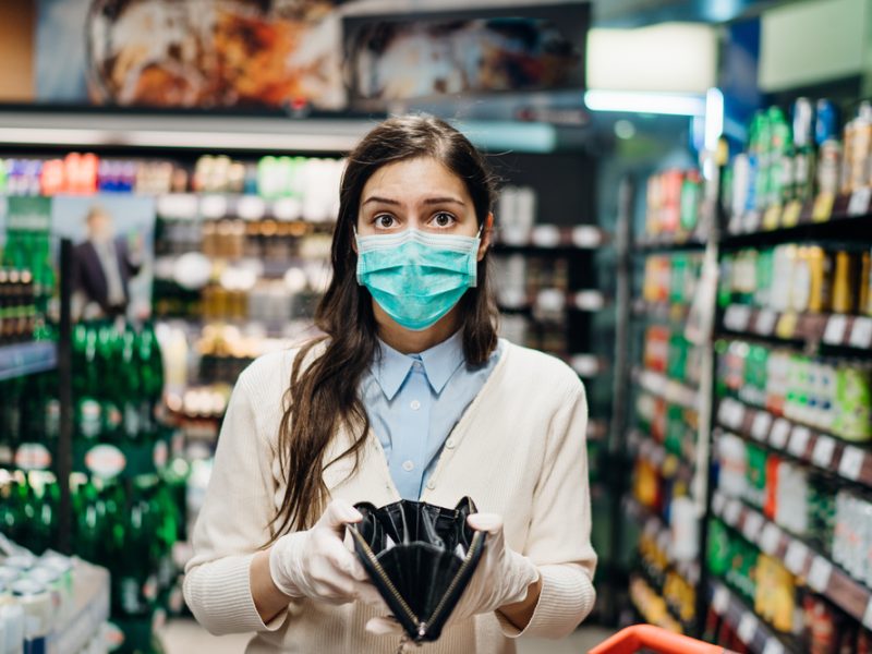 Grocery shopper looking stressed due to food inflation