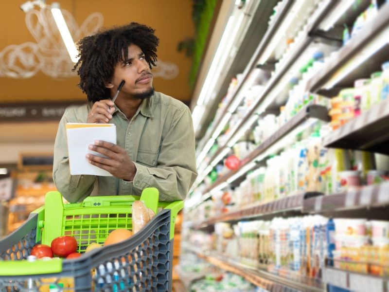 customer in supermarket looking concerned