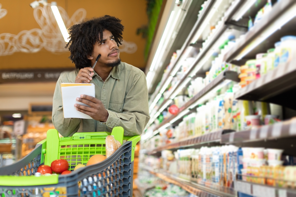 customer in supermarket looking concerned