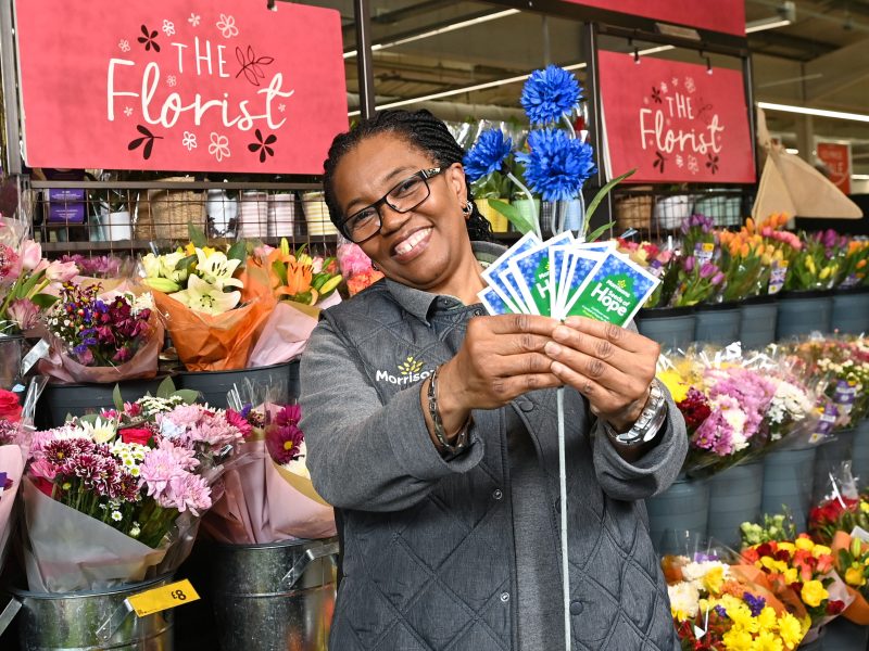 Morrisons employee holding up cornflower seeds