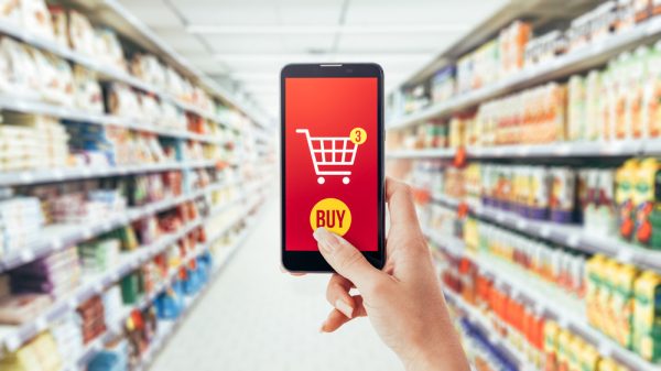 customer doing online shopping at a supermarket using app on phone