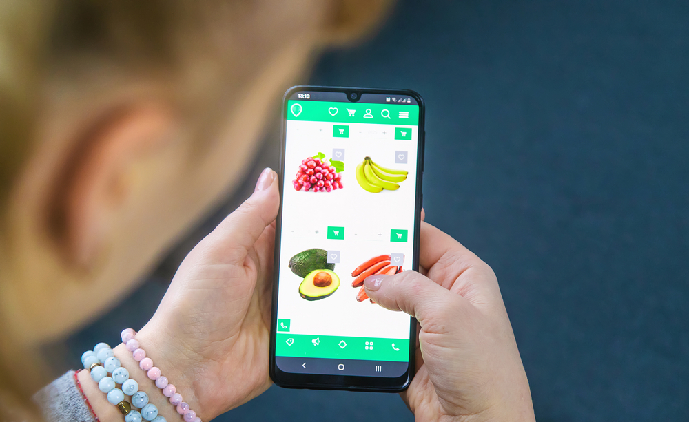 A phone displaying fresh groceries.