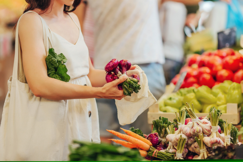 Shopper buying vegetables