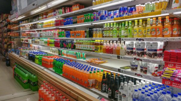 An aisle of soft drinks.