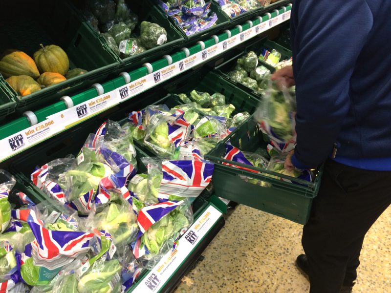 Vegetables in plastic packaging in UK supermarket.