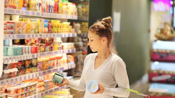 Shopper deciding on FMCG products at grocery store