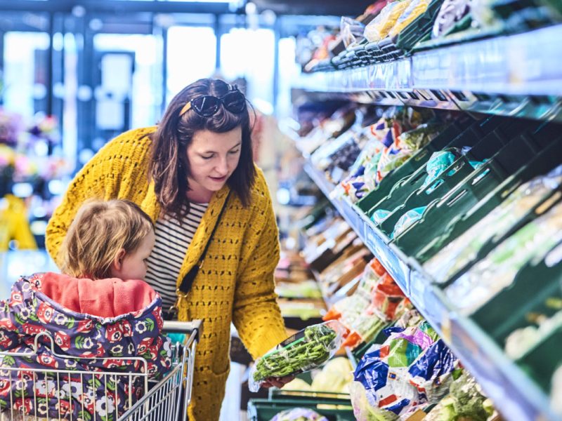 Aldi has cut the prices of more than 40 of its most popular grocery products in an aim to aid any shoppers feeling "squeezed" post-Christmas, here depicting a woman and a child shopping in Aldi